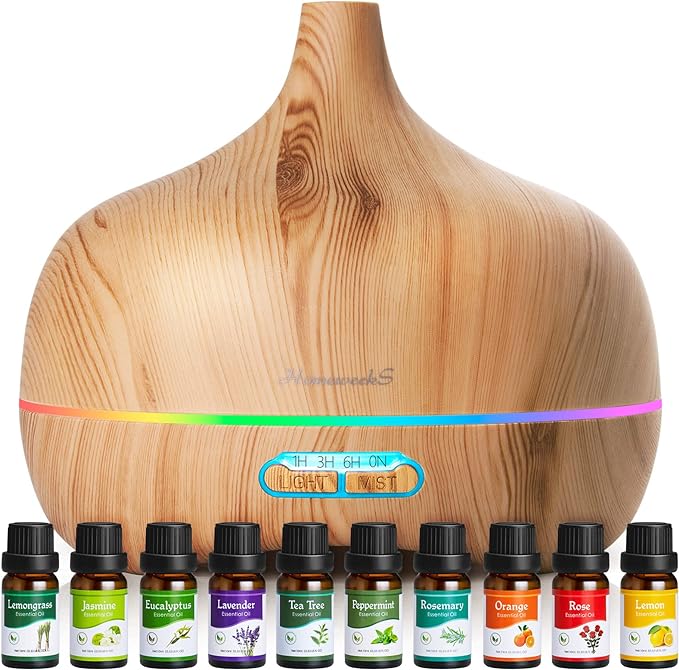 An aromatherapy diffuser with a collection of essential oils. Best gifts for self-care